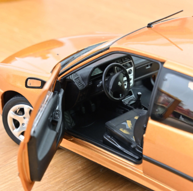 modellino auto scala 1/18 Peugeot 306 S16 oro modellini della norev